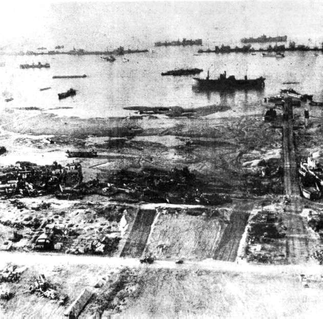 Debris strewn Normandy beach