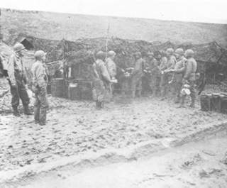 Chow lineup in the ever present mud near Metz.