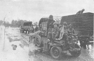 Jeeps carrying wounded have priority crossing the bridge over the Moselle.