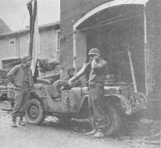 Staff Sergeant Crawles E. Adams plays his newly acquired horn for unappreciative audience in Sankt-Barbara, Germany.
