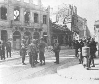 90th Men discussing plans in the town of Mainz, Germany.