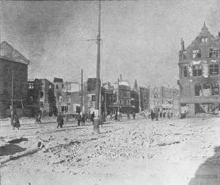 German civilians unconcernedly go about their business in battered Mainz, Germany.