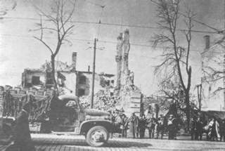 Freed slave workers watch task force arrive in front line town.