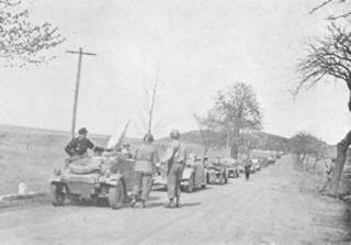 German vehicles flying white flags surrender to the 90th.