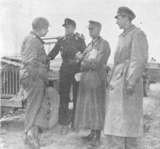 Three German staff officers talk with officer of the 90th after surrender.